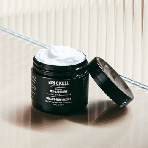 Brickell anti-aging cream jar with open lid