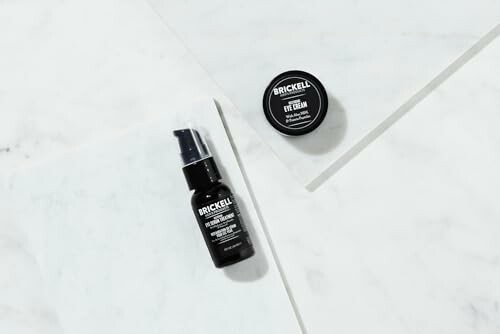 Brickell skincare products on a marble surface, showcasing natural ingredients and high-quality packaging.