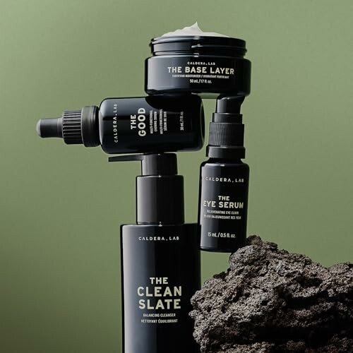 Caldera Lab skincare product lineup on green background.