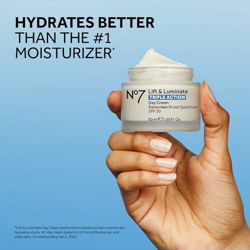 Hand holding No7 Lift & Luminate Triple Action Day Cream.